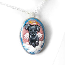 Load image into Gallery viewer, Small rock art of a black labrador retriever dog, painted as an angel, with halo and wings, sitting on clouds. available as a keepsake or pendant necklace
