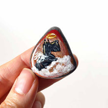 Load image into Gallery viewer, Rock art of a Scottish Terrier as an angel, painted on a small beach stone, this dog portrait is available as a keepsake, fridge magnet, or a pendant necklace
