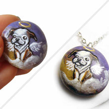 Load image into Gallery viewer, small rock art featuring a painting of an english bulldog painted as an angel in the clouds. available as a keepsake or necklace
