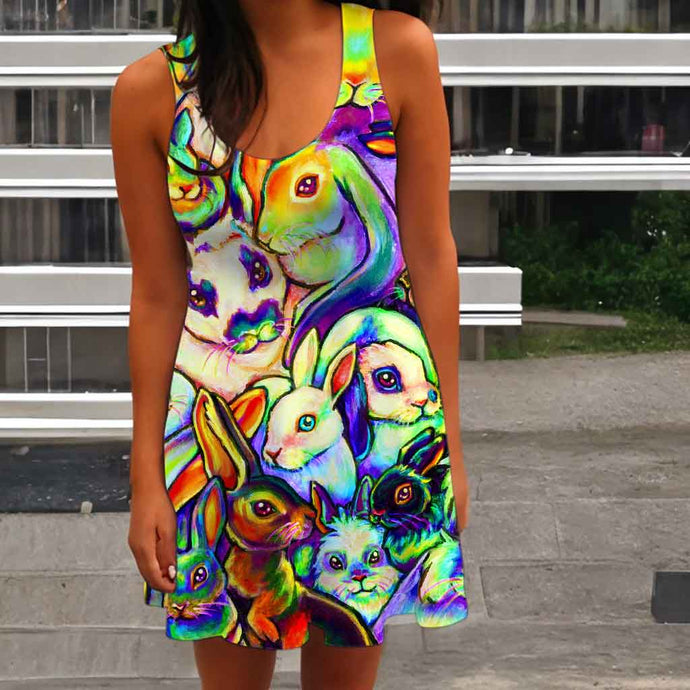 a person wearing the Bunny Lovers Rainbow Dress, featuring an illustration of many different rabbit breeds, painted in rainbow colours