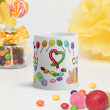 Load image into Gallery viewer, The Candy Lovers Mug, 11 oz size, is printed with 10 different types of candy in all the colours of the rainbow
