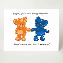 Load image into Gallery viewer, a greeting card with art of an orange gummy bear, holding the hand of a blue gummy bear, with the message, &quot;Sugar, spice, and everything nice. That&#39;s what our love is made of&quot;
