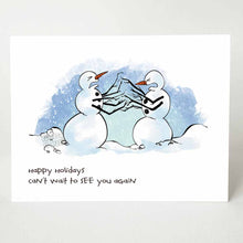 Load image into Gallery viewer, greeting card with an illustration of two snowmen facing each other, both with pained and angry expressions on their faces. multiple branches are in place of their arms, making it appearing as if they&#39;re fighting each other. the card reads &quot;happy holidays. can&#39;t wait to see you again&quot;
