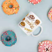 Load image into Gallery viewer, The Cookie Lovers Smile Mug in 11 oz size, includes a graphic of 10 different cookies with cartoon faces on them
