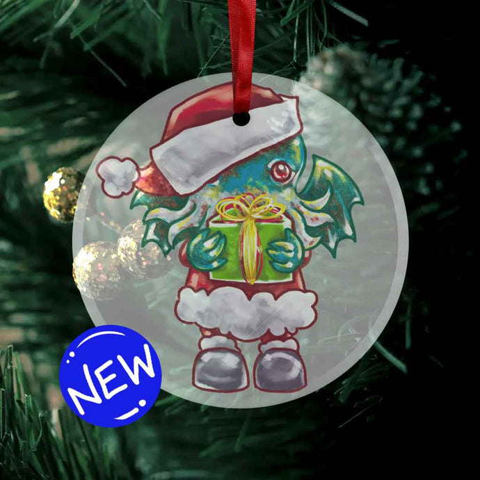 a round glass ornament, printed with an illustration of cthulhu dressed as santa clause, holding a present up for you