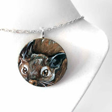 Load image into Gallery viewer, a small wood disc, featuring a painting of a little degu. this painting is available as a pendant or wood keepsake
