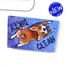 Load image into Gallery viewer, blue and purple wood magnet, hand painted with a corgi with a tail in a heart shape, tongue out, doing a sploot. near the top of the dog&#39;s head is the word CLEAN. written upside down next to the dog&#39;s butt is the word DIRTY
