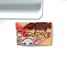 Load image into Gallery viewer, yellow/red wood magnet, hand painted, bottom features a white goat, with the word &quot;clean&quot; above them, at the top, upside down is a brown goat with little red horns with the word &quot;Dirty&quot; above them
