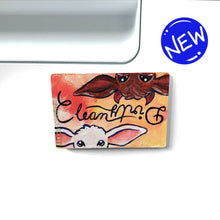 Load image into Gallery viewer, yellow/red wood magnet, hand painted, bottom features a white goat, with the word &quot;clean&quot; above them, at the top, upside down is a brown goat with little red horns with the word &quot;Dirty&quot; above them
