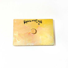 Load image into Gallery viewer, back of a yellow wood magnet, with a small magnet in the center, signed with, RainbowofCrazy
