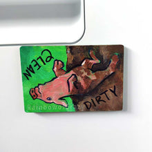 Load image into Gallery viewer, wood magnet on a dishwasher, hand painted with a pig with the word CLEAN (upside down) next to its face at the top. the second half of the pig is muddy, and written next to its body, DIRTY.
