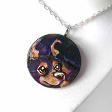 Load image into Gallery viewer, a small lightweight wood disc, hand painted with the portrait of a cute doberman dog. available as a wood keepsake or pendant necklace. 
