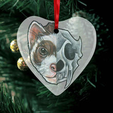 Load image into Gallery viewer, a heart shaped glass ornament, featuring an illustration of a ferret’s portrait. the left side features the ferret’s face, while the right side features a stylized ferret skull
