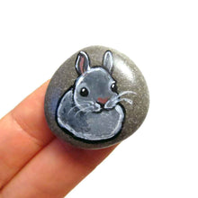 Load image into Gallery viewer, a small beach stone, hand painted with the portrait of a gray rabbit. available as a keepsake or pendant necklace
