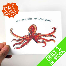 Load image into Gallery viewer, a greeting card featuring art of a red octopus with two tentacles stretched out. The card reads, &quot;I love you THIS much!&quot;
