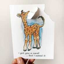 Load image into Gallery viewer, greeting card, featuring art of a giraffe. a corner of the card is ripped off and hangs from its mouth. Text reads, I got you a card! .. but I eated it
