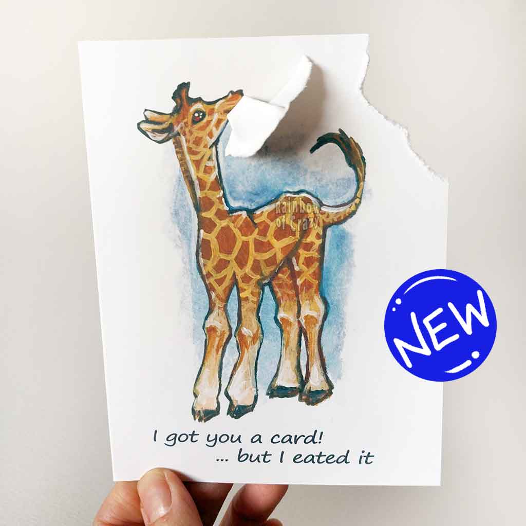 greeting card, featuring art of a giraffe. a corner of the card is ripped off and hangs from its mouth. Text reads, I got you a card! .. but I eated it 