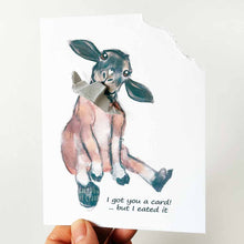 Load image into Gallery viewer, a funny greeting card with a black and brown sheep sitting upright, with the top right corner of the card ripped and hanging from its mouth. the card reads, &quot;I got you a card! ... but I eated it&quot;
