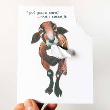Load image into Gallery viewer, a funny greeting card with a brown and black sheep, with the top right corner of the card ripped and hanging from its mouth. the card reads, &quot;I got you a card! ... but I eated it&quot;
