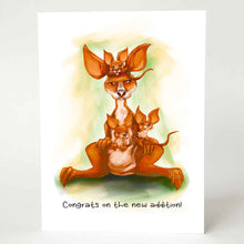 Load image into Gallery viewer, a greeting card, illustrated with a very unimpressed kangaroo, with three joeys holding on. it reads &quot;congrats on the new addition!&quot;
