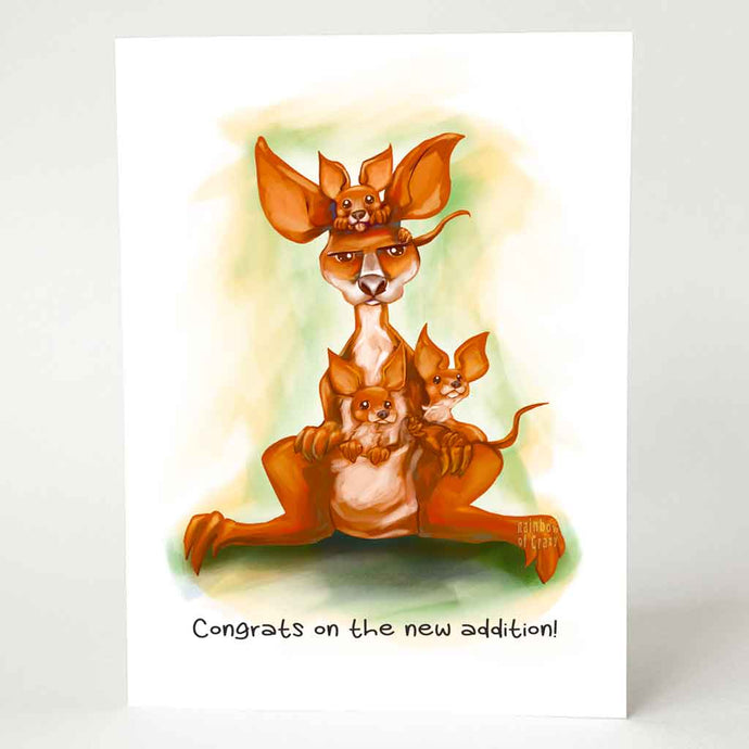 a greeting card, illustrated with a very unimpressed kangaroo, with three joeys holding on. it reads 