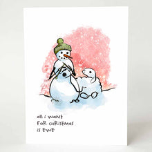 Load image into Gallery viewer, greeting card with an illustration of a smiling snowman wearing a green winter hat,  holding knitting needles as it knits from a smiling snow sheep. on the bottom, the card reads, &quot;all i want for Christmas is ewe&quot;
