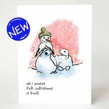 Load image into Gallery viewer, greeting card with an illustration of a smiling snowman wearing a green winter hat,  holding knitting needles as it knits from a smiling snow sheep. on the bottom, the card reads, &quot;all i want for Christmas is ewe&quot;
