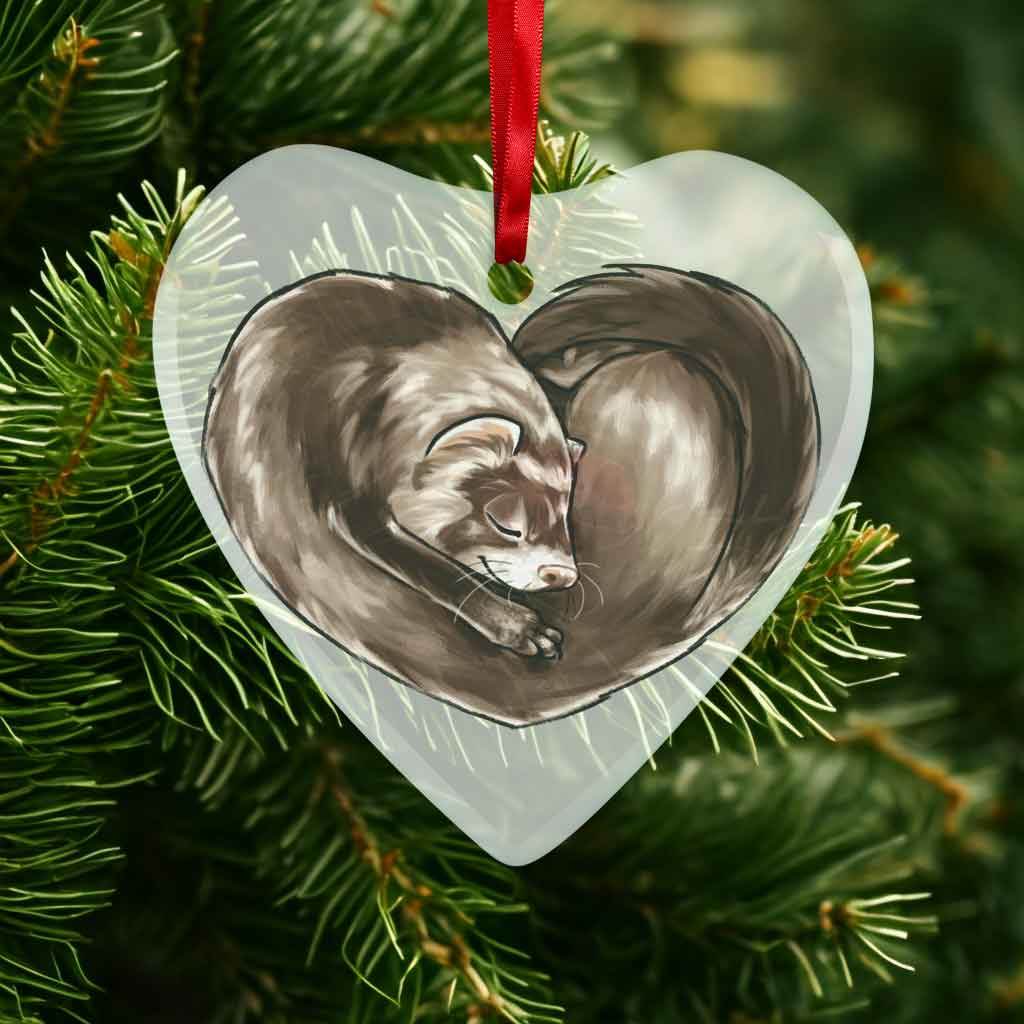 a heart shaped glass ornament, featuring an illustration of a ferret, curled up in the shape of a heart