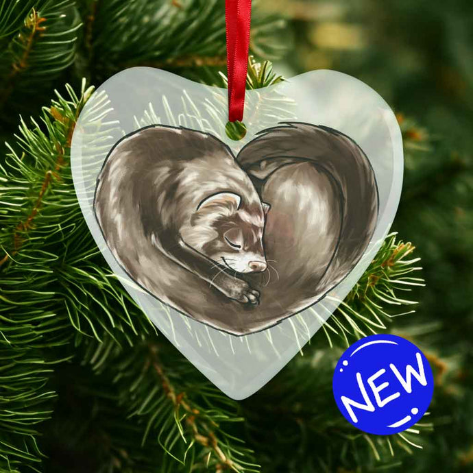 a heart shaped glass ornament, featuring an illustration of a ferret, curled up in the shape of a heart 