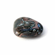 Load image into Gallery viewer, a smooth, flat, beach stone hand painted with a smiling hippopotamus, showing its feet on the underside, signed with, rainbowofcrazy
