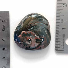 Load image into Gallery viewer, a smooth, flat, beach stone hand painted with a smiling hippo
