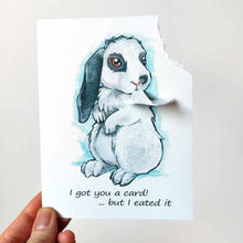 Load image into Gallery viewer, a greeting card with art of a white and gray mini lop rabbit. The card reads, &quot;I got you a card! ... but I eated it&quot;. be the top right corner of the card is ripped and hangs from the rabbit&#39;s mouth
