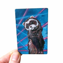 Load image into Gallery viewer, small wood rectangle fridge magnet, hand painted with a portrait of an fluffy ferret, posing in front of a retro 80s / 90s blue background with blue and pink lasers
