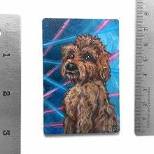 Load image into Gallery viewer, small wood rectangle fridge magnet, hand painted with a portrait of an apricot / brown Labradoodle dog, posing in front of a retro 80s / 90s blue background with blue and pink lasers
