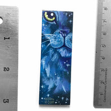 Load image into Gallery viewer, small wood rectangle fridge magnet, hand painted with a close-up portrait of a fluffy cat painted in purples and blues, closely resembling a lion, against a galaxy background of stars
