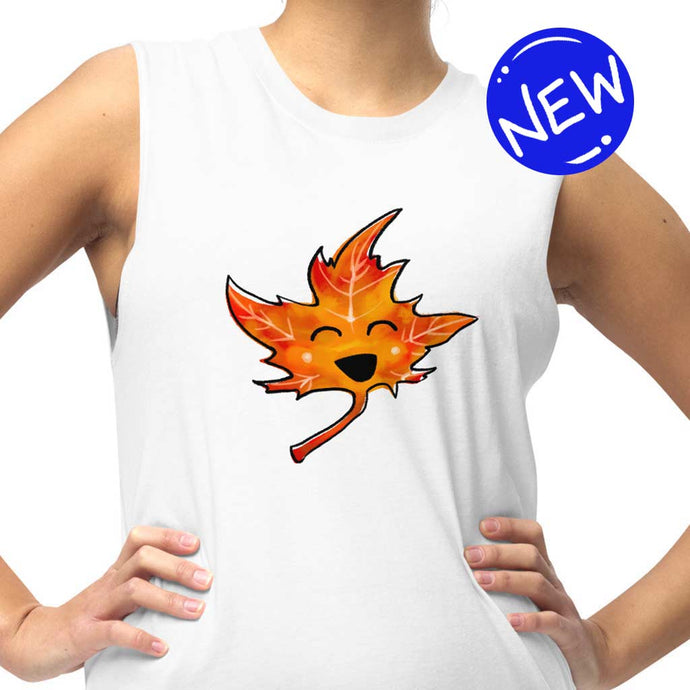 person is wearing a unisex muscle tank top in the colour white, featuring a graphic of a smiling maple leaf