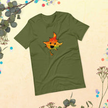 Load image into Gallery viewer, a t-shirt in the colour olive green, featuring a smiling maple leaf
