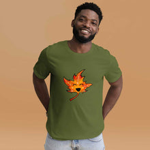 Load image into Gallery viewer, a person wears a t-shirt in the colour olive green, featuring a graphic of a smiling maple leaf

