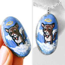 Load image into Gallery viewer, a small beach stone, hand painted with a little brown and white mouse as an angel in the clouds, with a halo and wings. the stone is available as a keepsake rock art or as a pendant necklace
