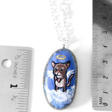 Load image into Gallery viewer, a small beach stone, hand painted with a little brown and white mouse as an angel in the clouds, with a halo and wings. the stone is available as a keepsake rock art or as a pendant necklace
