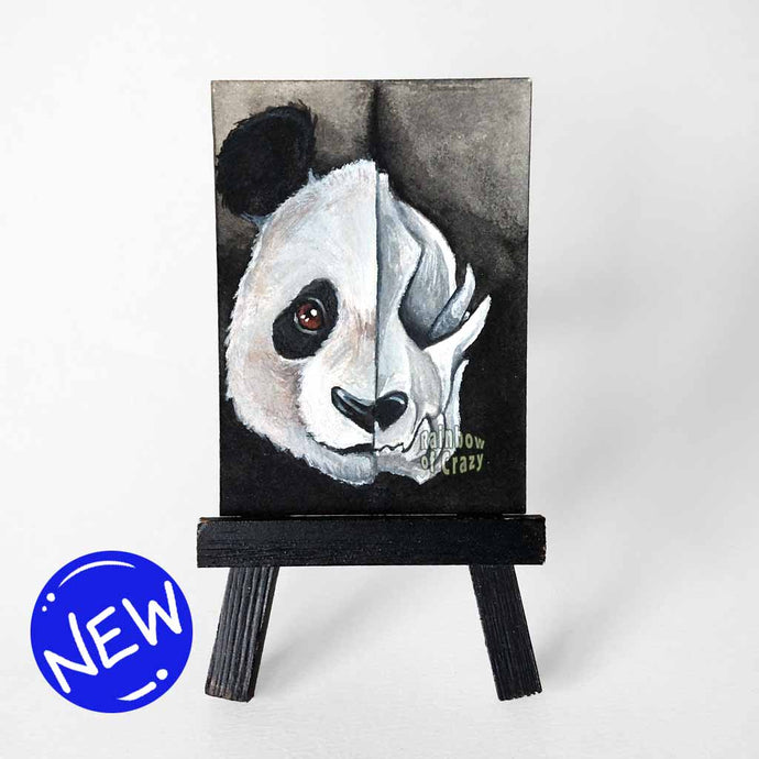 an aceo sized painting, split into two sides, a pandas face on the left and a creepy panda skull on the right.