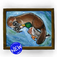 Load image into Gallery viewer, an art print featuring an illustration of a platypus and a mallard duck, swimming together, touching bills
