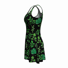 Load image into Gallery viewer, the Plant Lovers Black Dress, a skater style dress featuring an all over print, illustrated with a variety of plants from the garden
