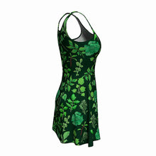 Load image into Gallery viewer, the Plant Lovers Green Dress, a skater style dress featuring an all over print, illustrated with a variety of plants from the garden
