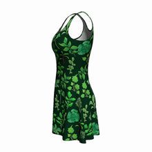 Load image into Gallery viewer, the Plant Lovers Green Dress, a skater style dress featuring an all over print, illustrated with a variety of plants from the garden
