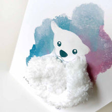 Load image into Gallery viewer, a greeting card with an illustration of a polar bear. thick, fluffy white yarn makes up the bear&#39;s body. the background has a splash of blue and purple. the front says, &quot;Happy Bear-day!&quot;
