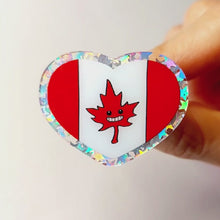 Load and play video in Gallery viewer, heart acrylic pin featuring the Canada flag, the maple leaf stylized with happy face.
