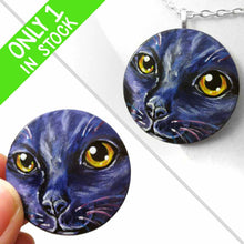 Load image into Gallery viewer, A wood disc painted with the portrait of a cat in dark purple and black, available as a keepsake or pendant necklace
