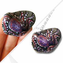 Load image into Gallery viewer, a purple and pink octopus painting on a small beach stone, available as a keepsake or pendant necklace
