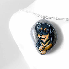 Load image into Gallery viewer, small beach stone, hand painted with art of a rottweiler dog
